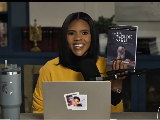Photo: Owens promotes an antisemitic book, “The Talmudic Jew,” on a December 2025 podcast episode. (Screenshot/YouTube)