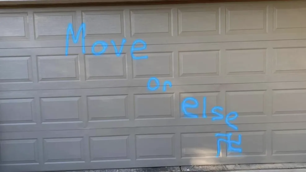 Photo: Mesa, Ariz. -- A swastika and the threat "Move or else" spray-painted on a house’s garage in June. One other home, a car and street signs were also vandalized with antisemitic graffiti in the same neighborhood.